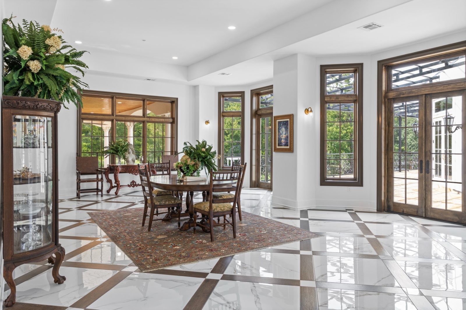 Formal dining room with floor-to-ceiling windows